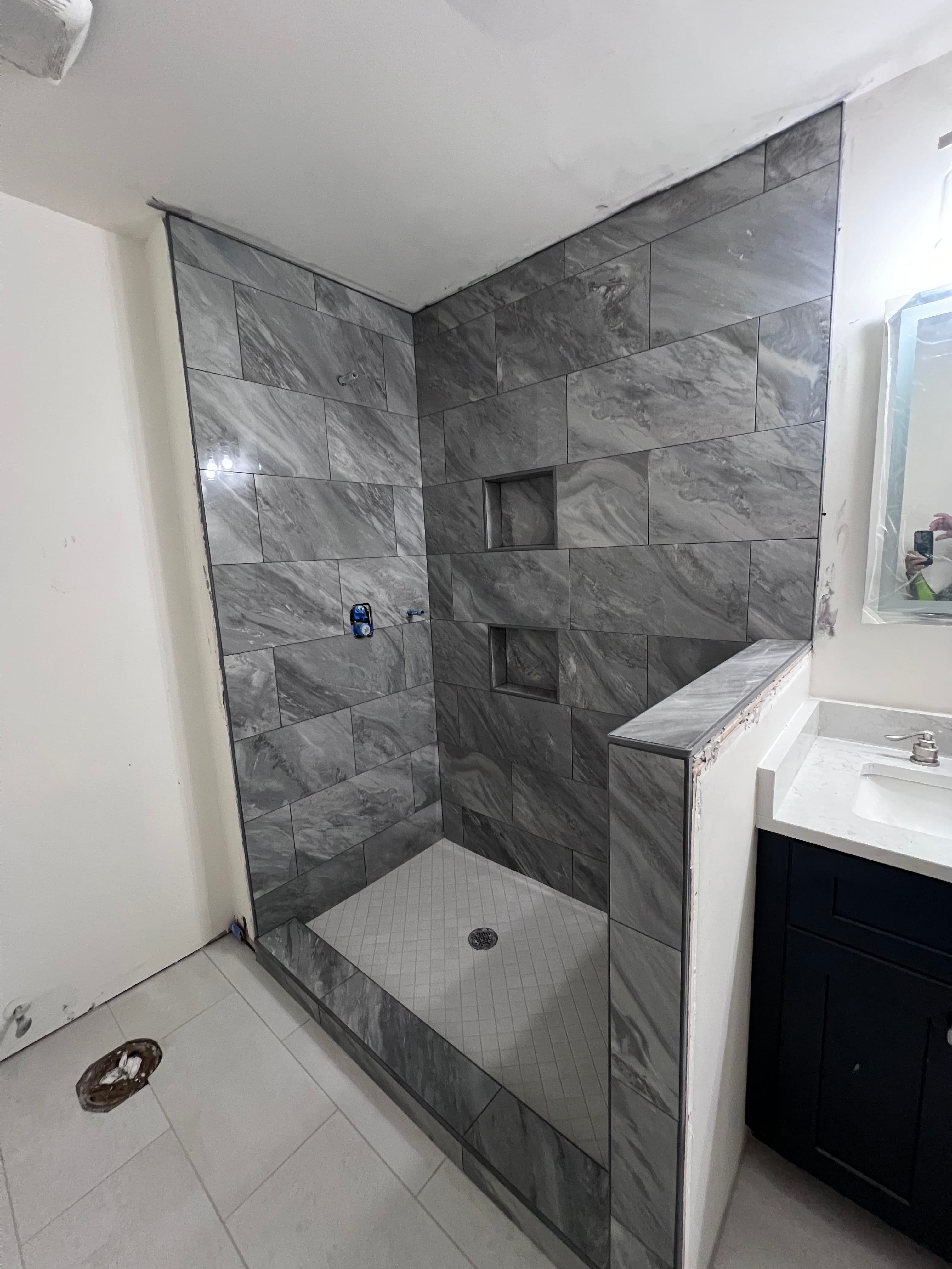 Project Fresh Bathroom Makeover Featuring Elegant Dark Gray Tiles image