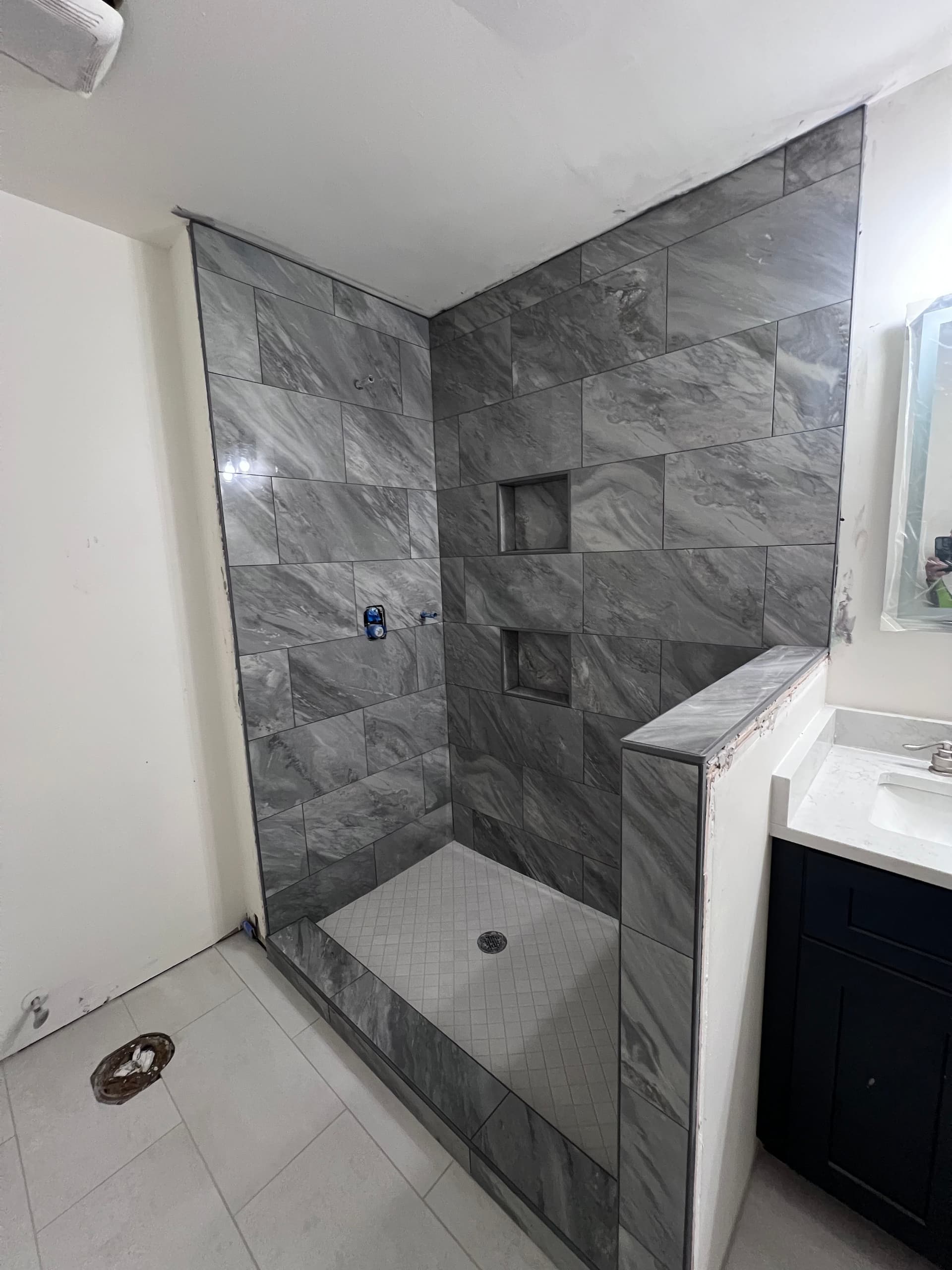 Gallery photos for Fresh Bathroom Makeover Featuring Elegant Dark Gray Tiles: Image #1
